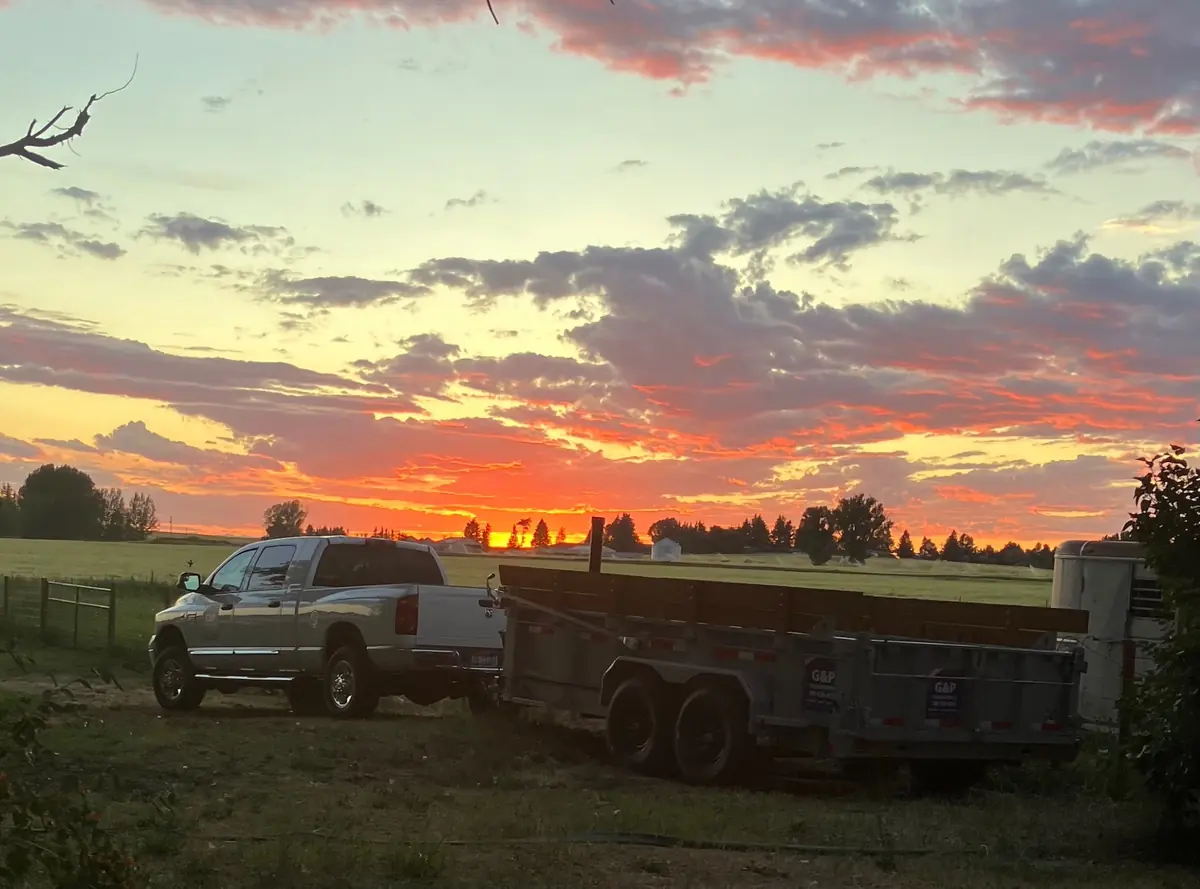 G&P trailer and truck at sunset in a rural Idaho setting