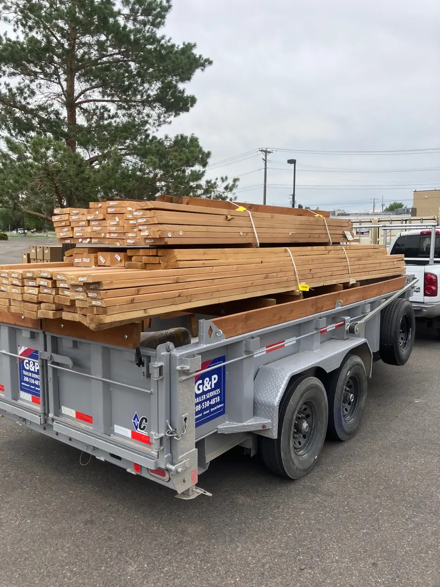 Trailer loaded with lumber for material delivery